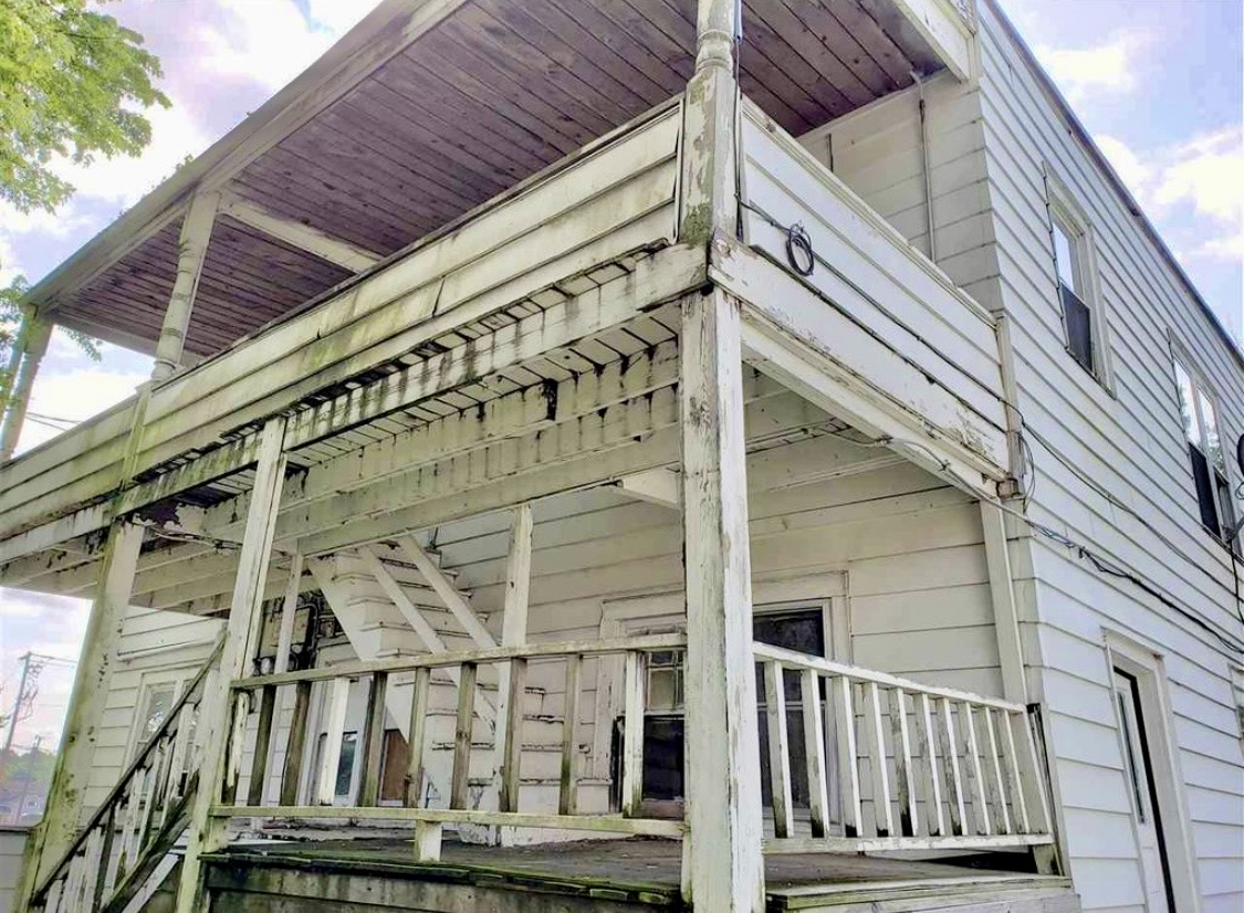 Janesville Italianate 4plex: rear porch before renovation