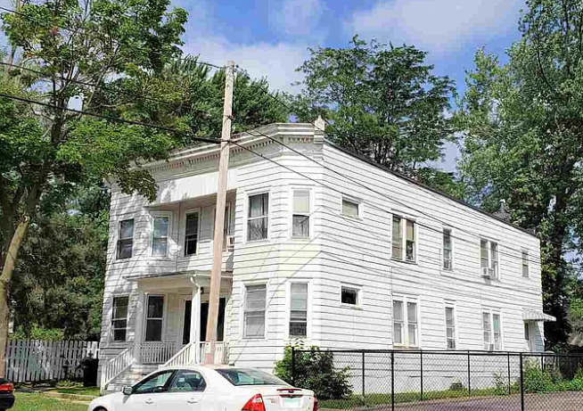 Janesville Italianate Multifamily — rear before